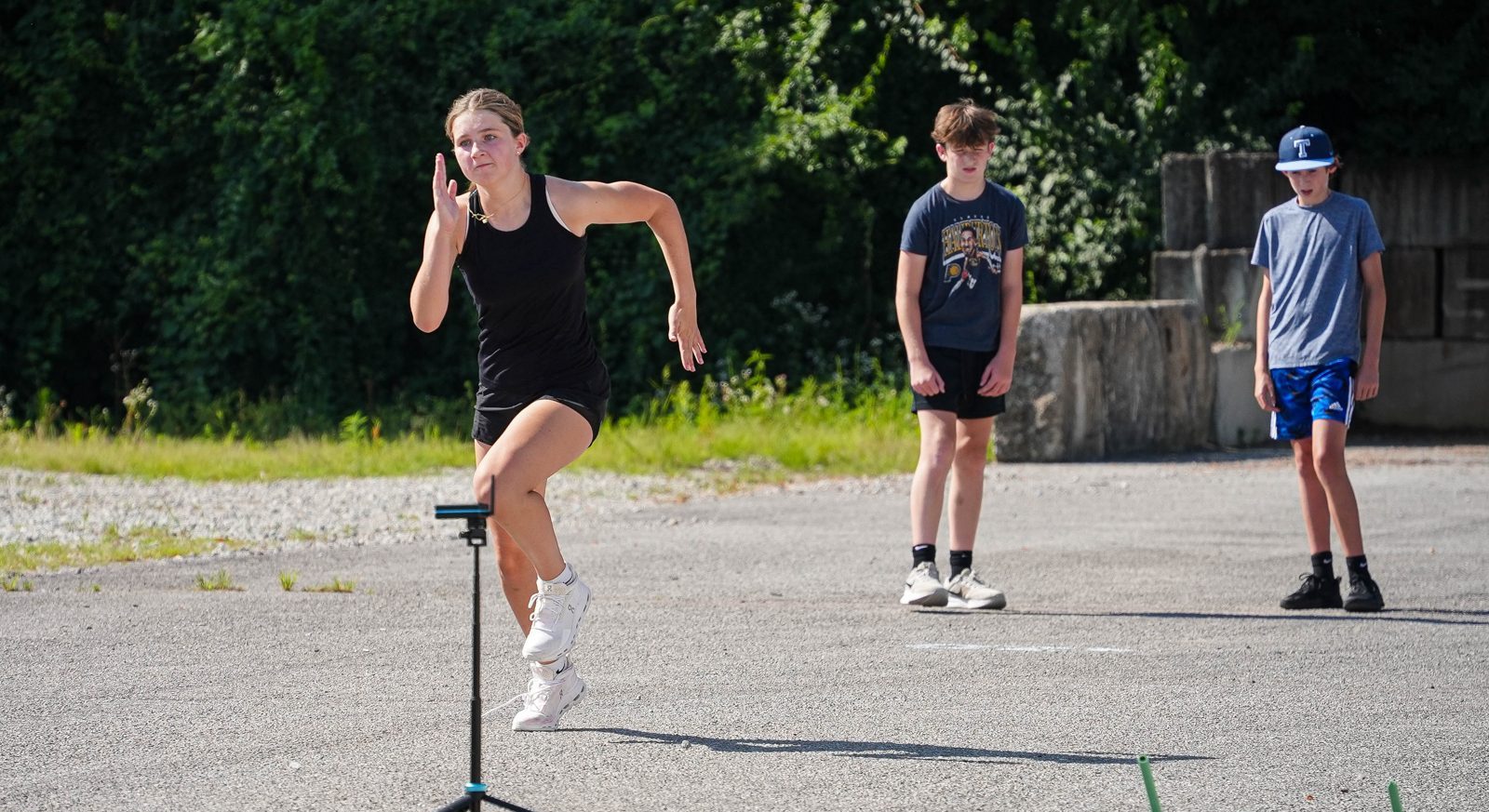 Athlete sprinting through timing gates